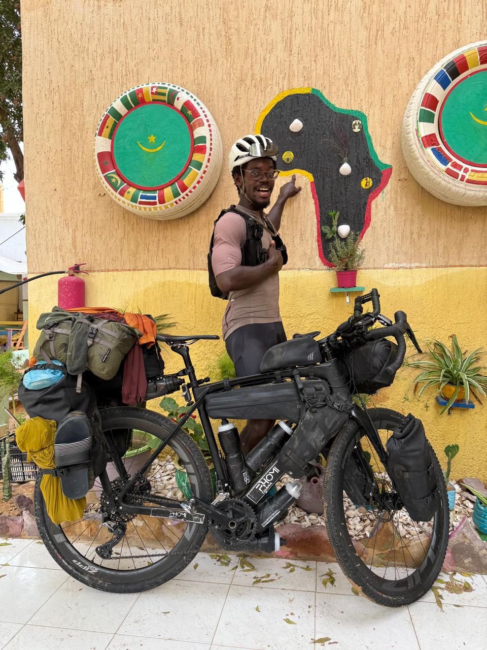 Ghanaian cyclist nears end of epic intercontinental journey to champion education