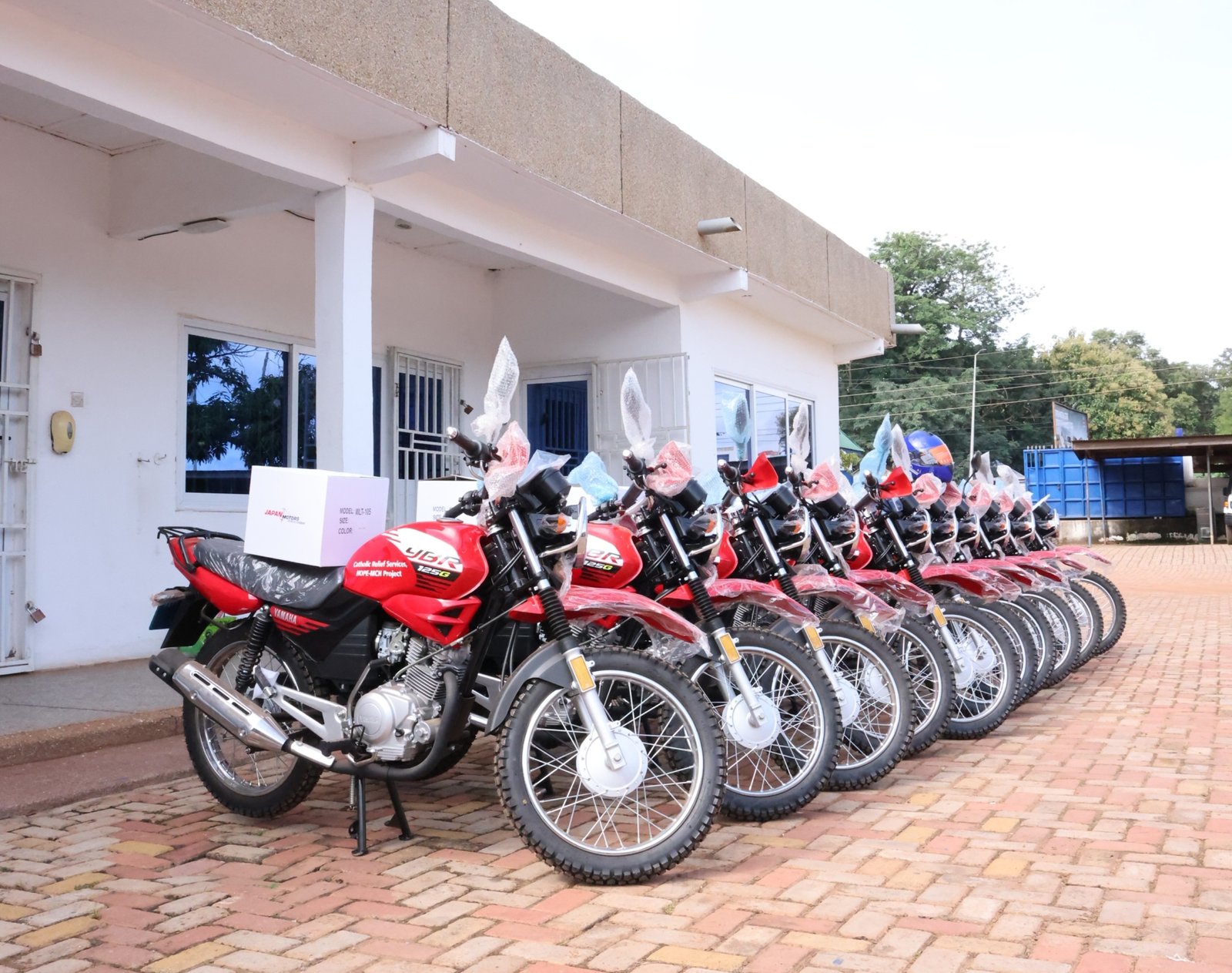 Catholic Relief Services donates 10 motorcycles to National Ambulance Service