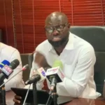 John Darko addresses the press