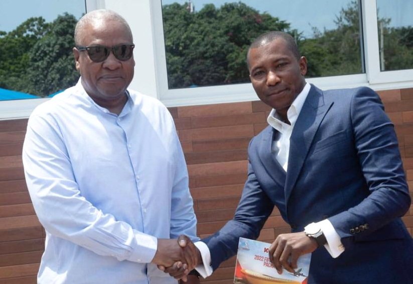 Kennedy Agyapong, right, in a handshake with President Mahama