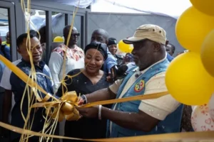KoKMA tackles open Mr Allotey Gaisie right being assisted by other officials to cut the tape to inau