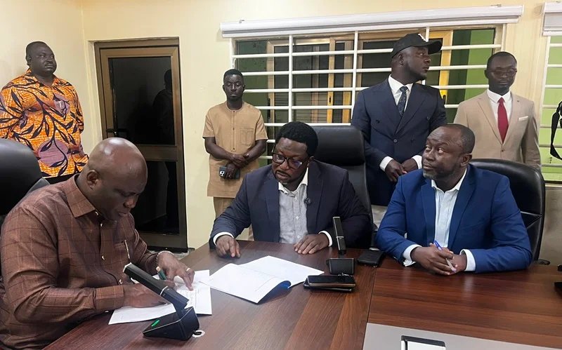 MOFA Mr Opoku left with Mr Adimado and others during the signing ceremony