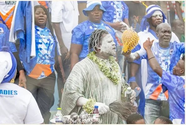 A section of Port City fans cheering the team
