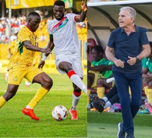 Black StarsFelix Afena Gyan in a tussle for the ball with The Gambia defender James Gomez
