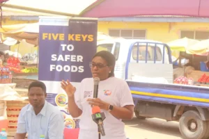 Food Safety Updated Mrs Maureen Lartey inset addressing traders at the Mallam Atta Market in Accra