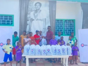Melcom Care Foundation donates meals Mr Kpormegbey right back row presenting the packed meals to the
